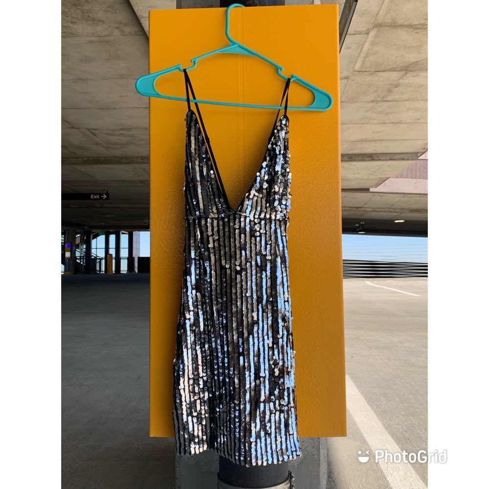 Black and silver, eye catching, modern, night out with the girls dress. Size: 0